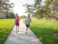 Couple running on community trail
